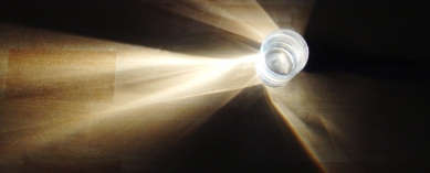 Rolling the flashlight up or down will cause the light to be refracted as it passes through the water.