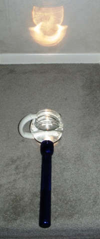 To make a rainbow, use a flashlight and a large, wide glass of water.