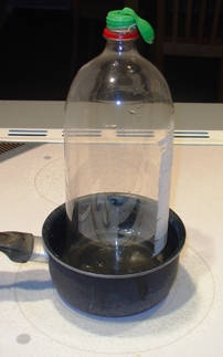 The air inside the bottle is cool - the balloon is deflated